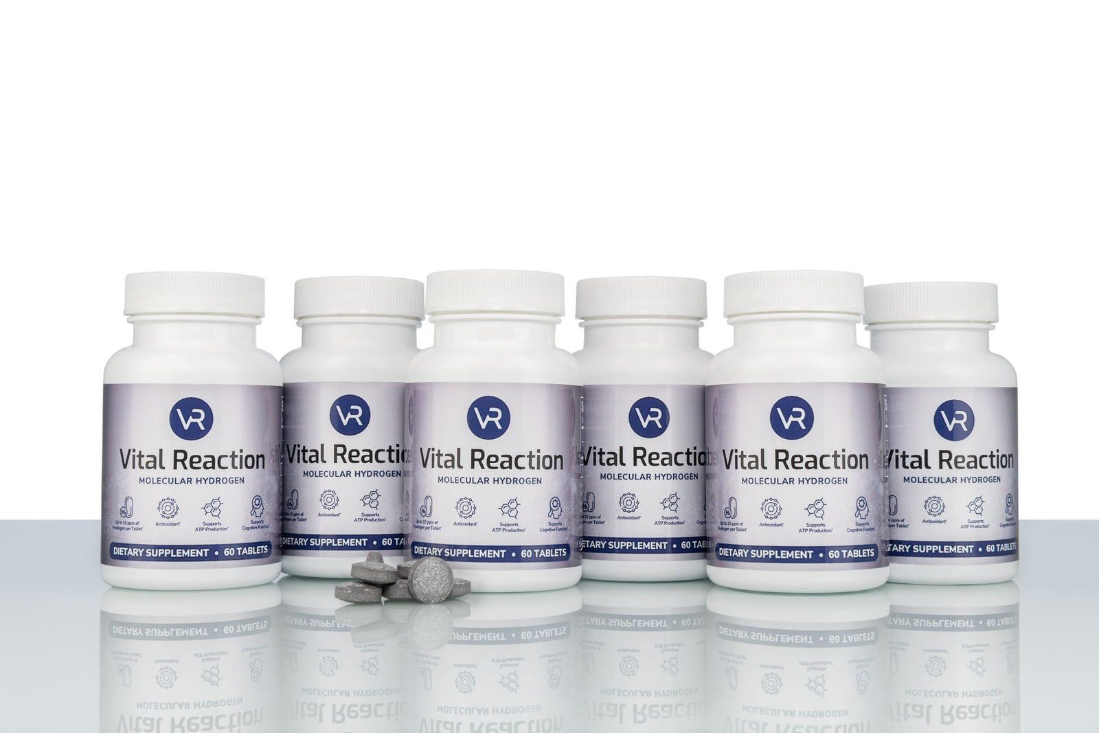 H2 tablets in front of 6 vital reaction molecular hydrogen tablet bottles